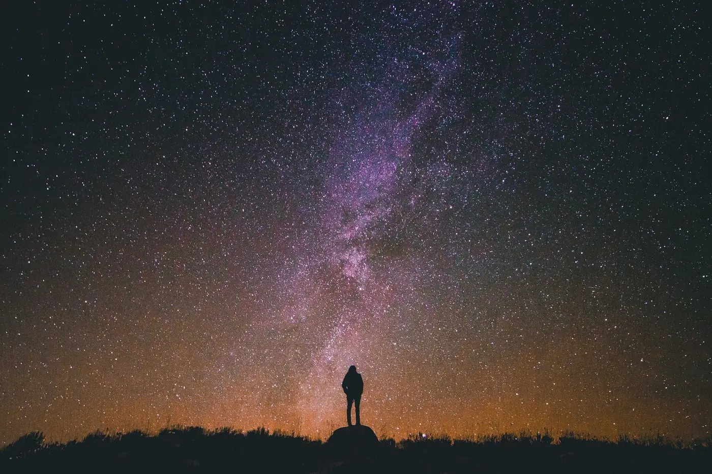 Person under a starry night sky