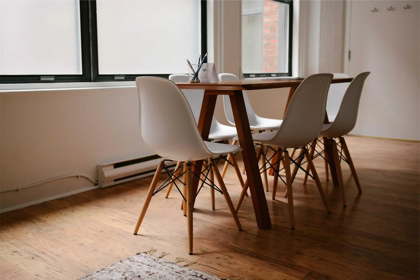 Bright dining room with white chairs