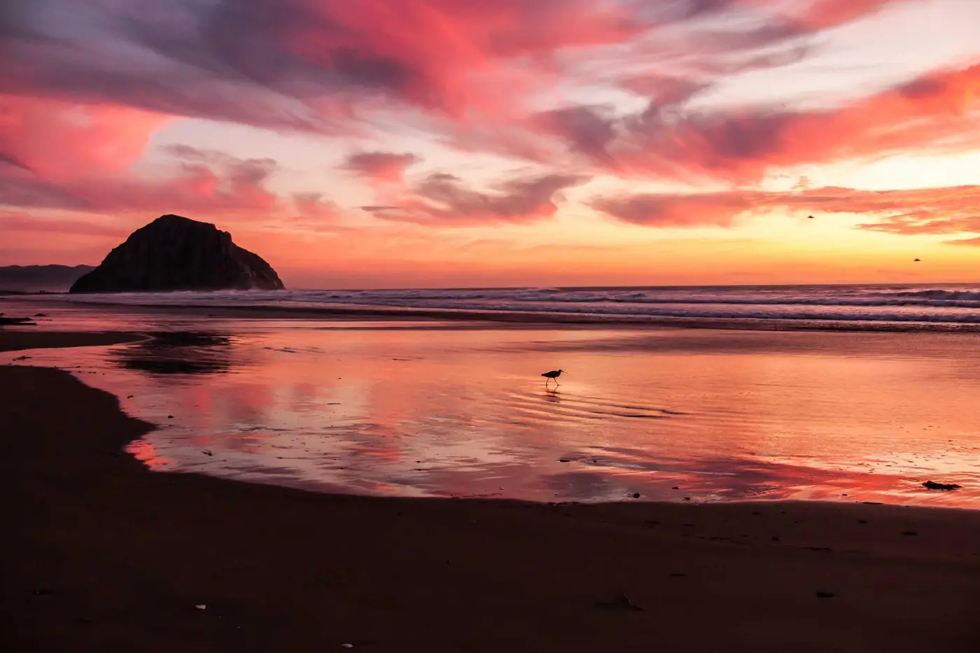 Waves on a beach at sunset